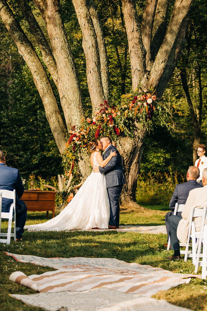 bride and groom outdoor wedding ceremony with big tree