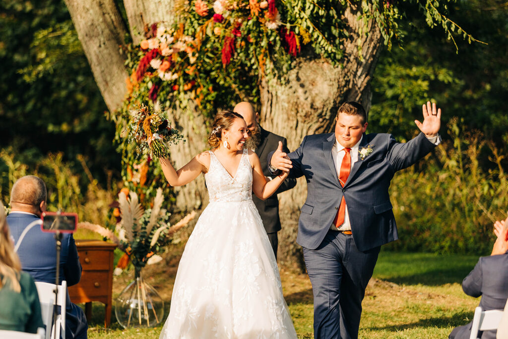 bride and groom dancing outdoor wedding ceremony with big tree