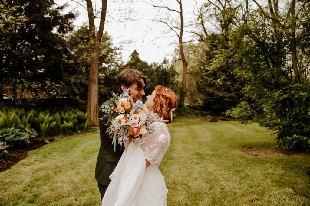 bride and groom in wooded area