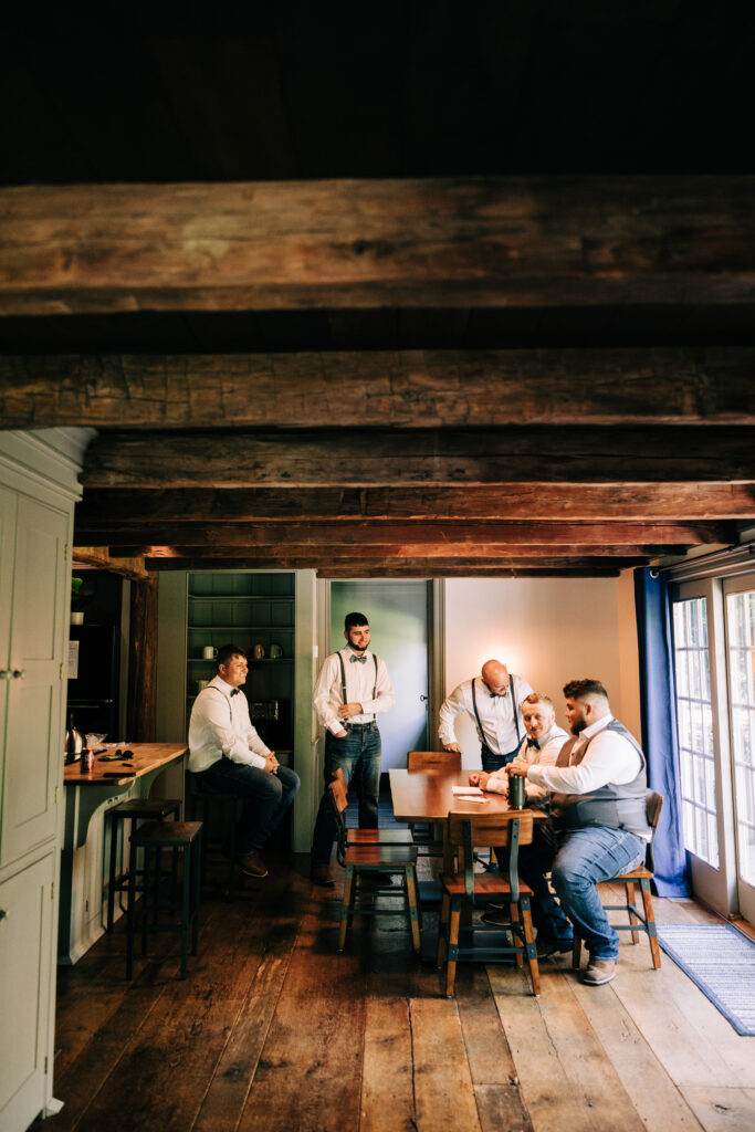 groomsmen in farmhouse kitchen