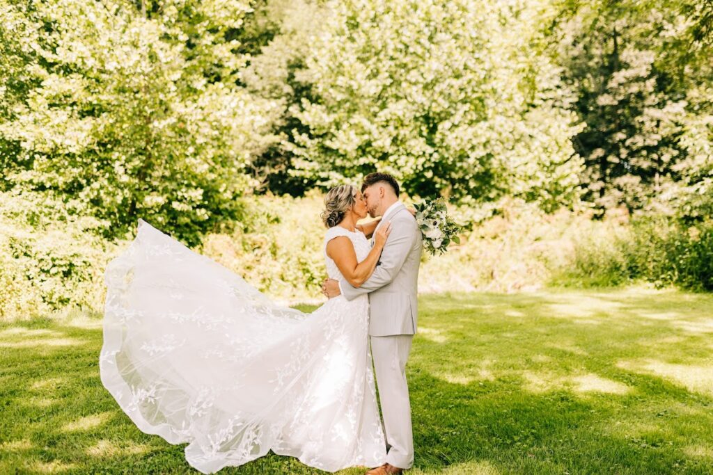 bride and groom in wooded area
