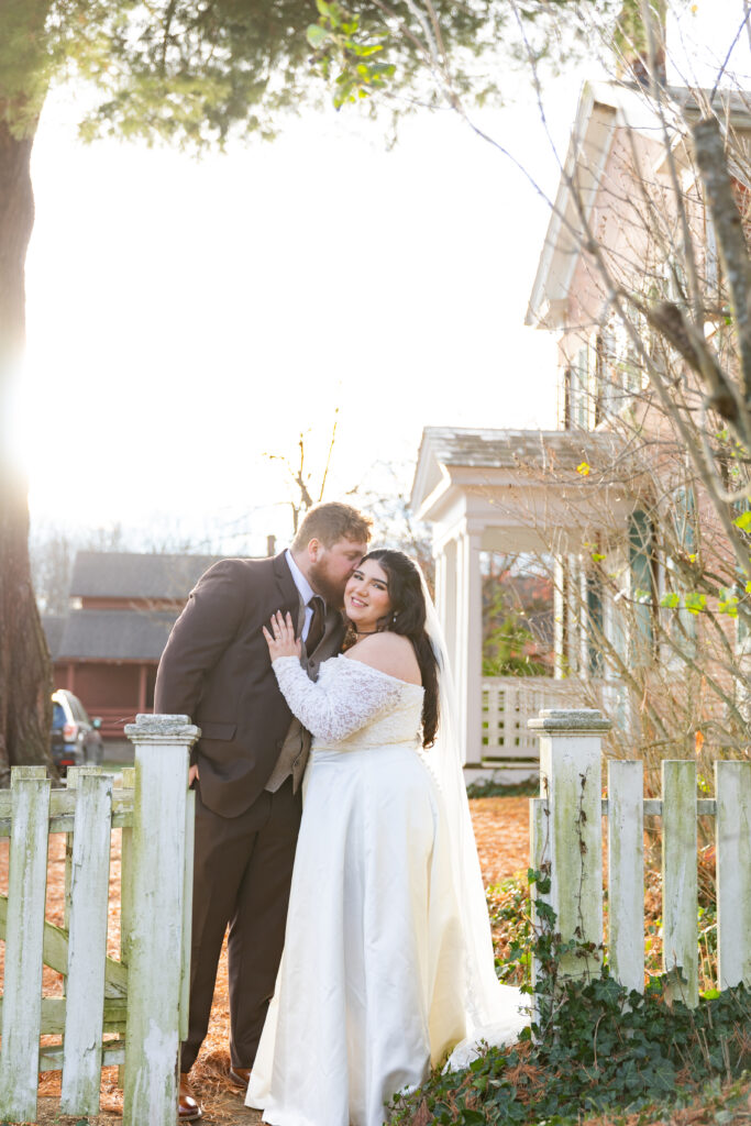 bride and groom at farmhouse with porch