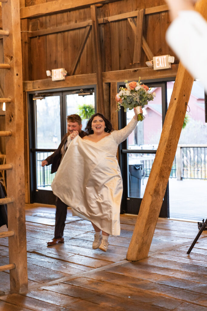 bride and groom reception entrance at barn venue