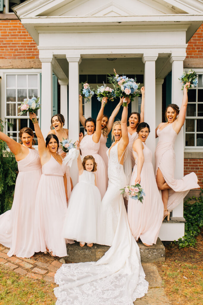 bridesmaids on porch with white pillars