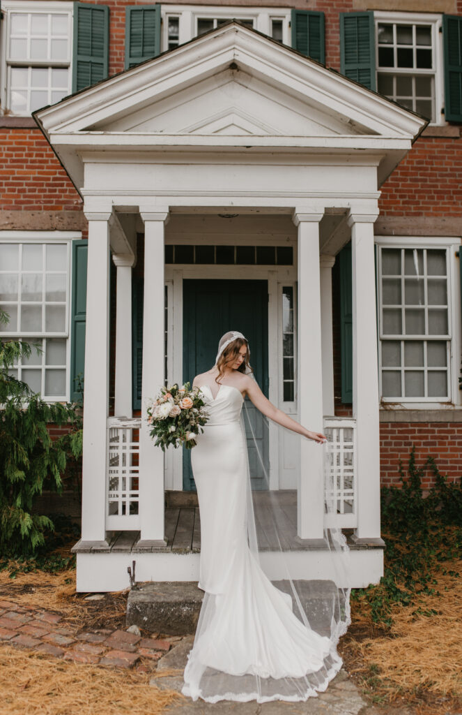 bride on porch with white pillars