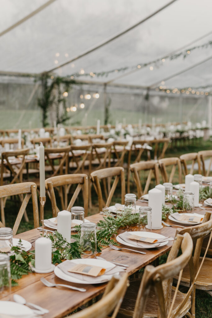 wooden table settings clear outdoor tent reception