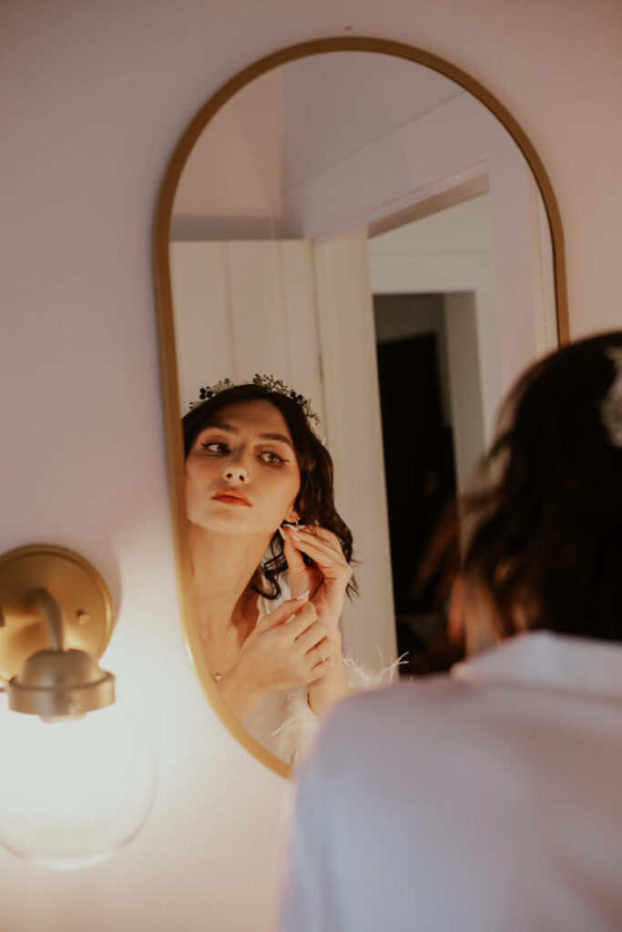 Bride looking in mirror