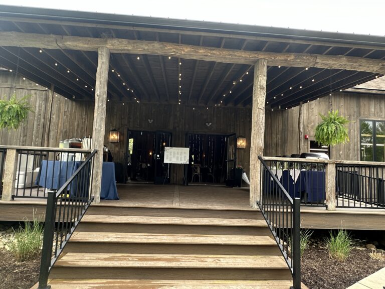 buffet set up on porch of rustic Ohio barn wedding venue