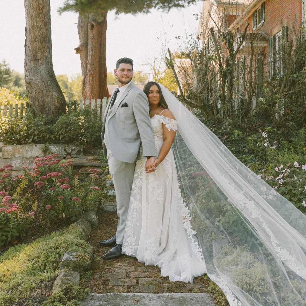 bride and groom in garden at farmhouse