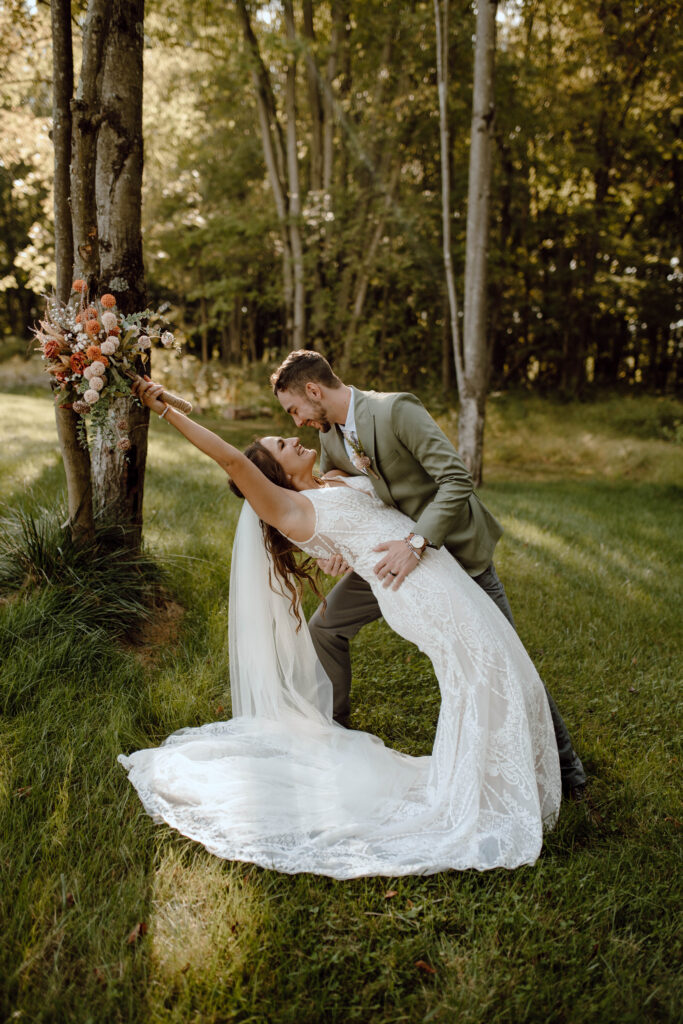 bride and groom in wooded area