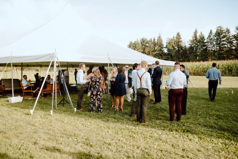 people at tent at outdoor wedding